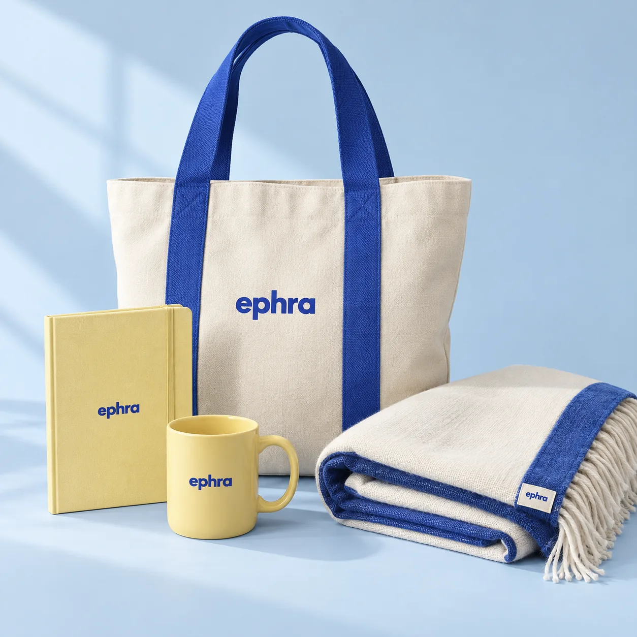 The complete Ephra collection with tote, notebook, mug and throw. Product concept.